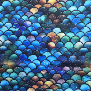 Een katoenen stof met drakenschubben patroon erop.