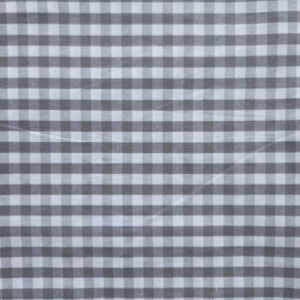 Een geruit patroon. Wit met grijze kleine vakjes. De stof is gemaakt van katoen.